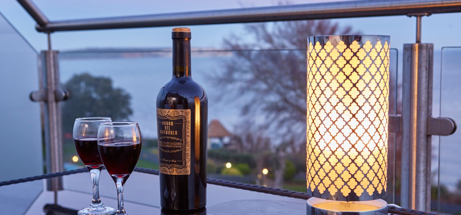 A glass of wine with a sea view