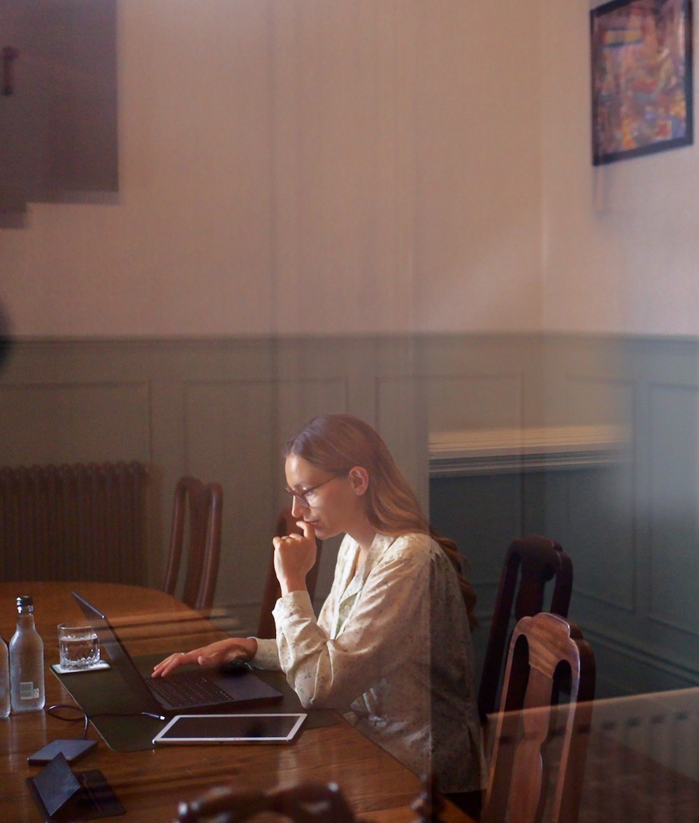 A guest working at the meeting table