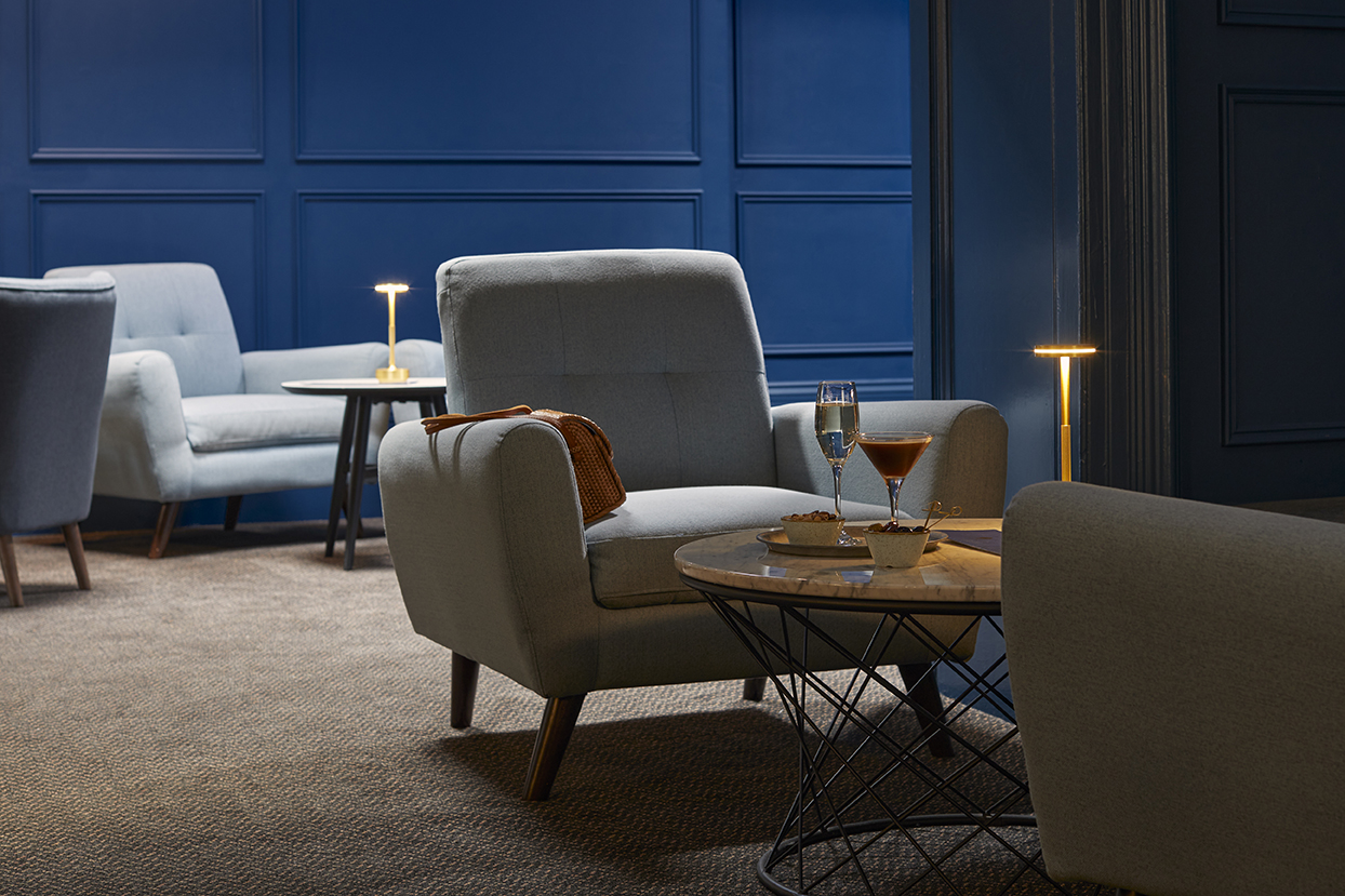 Armchairs by the fire in the Bishops Bar