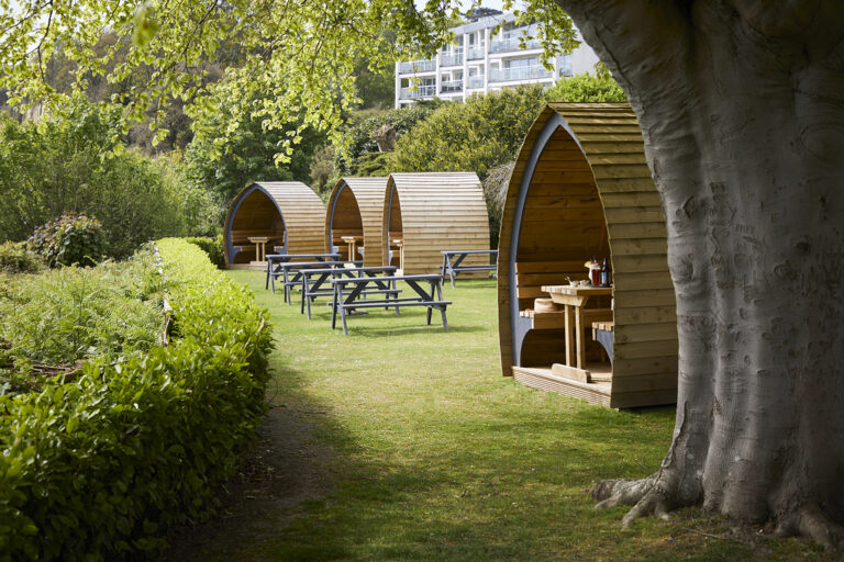 Garden pods with a sea view at Luccombe Hall